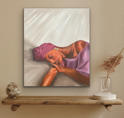 Woman with purple headwrap resting on beige background