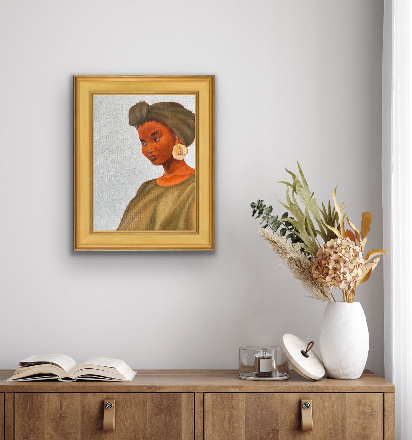 Rock oil painting of woman with green headwrap, dress and flower earring